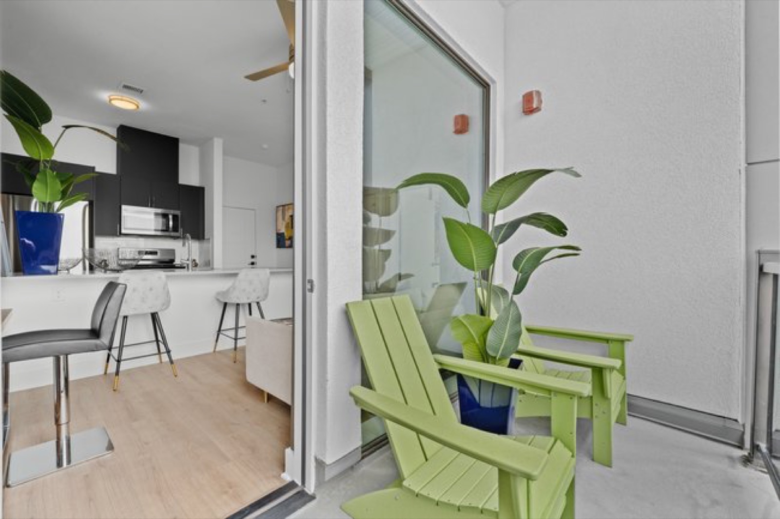 Private balcony with glass doors in Unit 208