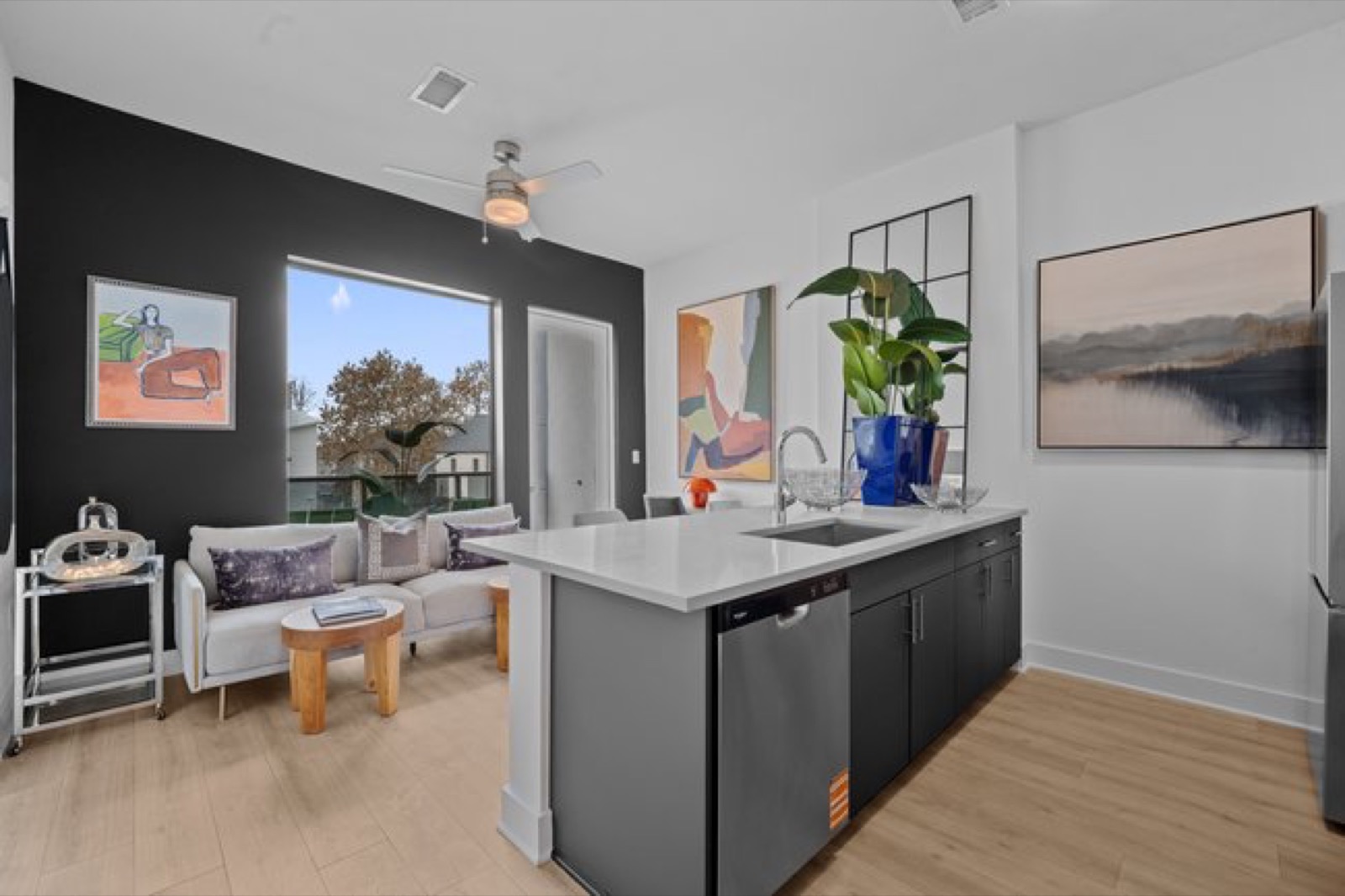 Open-concept kitchen and living area in Unit 208