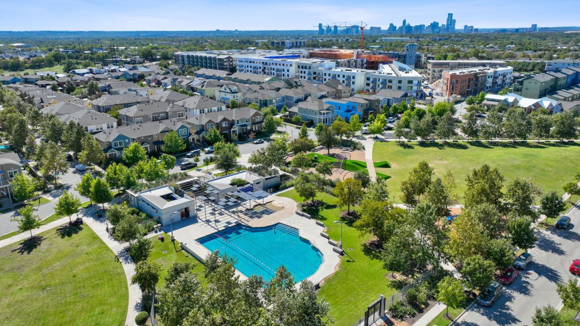 Mueller aerial view with downtown Austin skyline